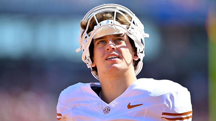 Texas Longhorns quarterback Arch Manning looks on before the game between the Sooners and the Longhorns at Cotton Bowl. Texas Longhorns quarterback Arch Manning looks on before the game between the Sooners and the Longhorns at Cotton Bowl.
