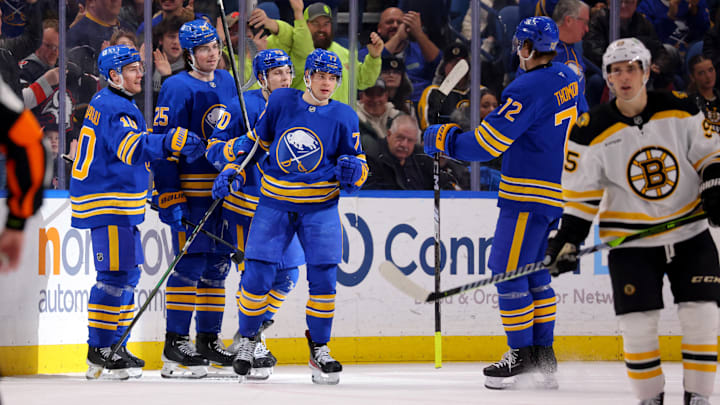 Jan 28, 2025; Buffalo, New York, USA;  Buffalo Sabres right wing JJ Peterka (77) celebrates his goal with teammates during the third period against the Boston Bruins at KeyBank Center. Mandatory Credit: Timothy T. Ludwig-Imagn Images