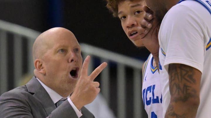Feb 7, 2026; Los Angeles, California, USA;  UCLA Bruins head coach Mick Cronin talks with guard Trent Perry (0) and guard Brandon Williams (5) in the second half against the Washington Huskies at Pauley Pavilion presented by Wescom Financial. Mandatory Credit: Jayne Kamin-Oncea-Imagn Images