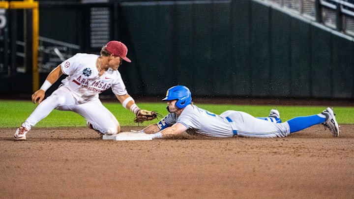Jun 17, 2025; Omaha, Neb, USA; UCLA Bruins right fielder A.J. Salgado (24) slides to second after hitting an RBI double in the 9th at Charles Schwab Field. Mandatory Credit: Dylan Widger-Imagn Images Jun 17, 2025; Omaha, Neb, USA; UCLA Bruins right fielder A.J. Salgado (24) slides to second after hitting an RBI double in the 9th at Charles Schwab Field. Mandatory Credit: Dylan Widger-Imagn Images