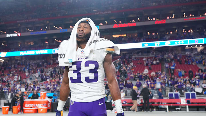 Jan 13, 2025; Glendale, AZ, USA; Minnesota Vikings running back Aaron Jones (33) reacts after the NFC wild card game against the Los Angeles Rams at State Farm Stadium. 
