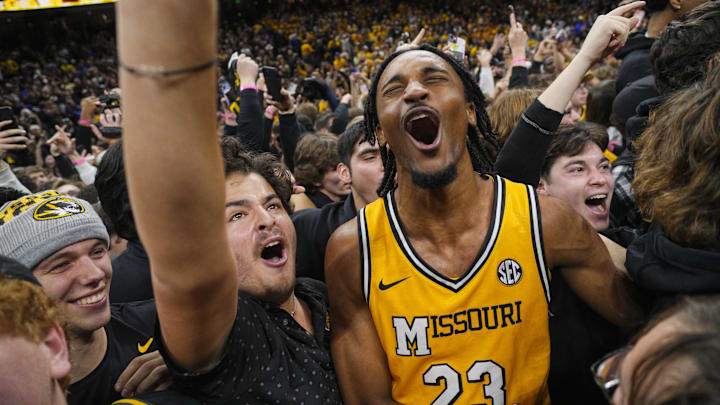Dec 8, 2024; Columbia, Missouri, USA; Missouri Tigers guard Aidan Shaw (23) celebrates with fans after defeating the Kansas Jayhawks at Mizzou Arena. Mandatory Credit: Jay Biggerstaff-Imagn Images