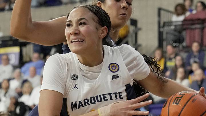Jan 1, 2025; Milwaukee, WI, USA; Marquette forward Skylar Forbes (11) droves around Connecticut center Jana El Alfy (8) during the second half of their game Wednesday, January 1, 2025 at the Al McGuire Center in Milwaukee, Wisconsin. Connecticut beat Marquette 77-45. Mandatory Credit: Mark Hoffman/USA TODAY NETWORK via Imagn Images Jan 1, 2025; Milwaukee, WI, USA; Marquette forward Skylar Forbes (11) droves around Connecticut center Jana El Alfy (8) during the second half of their game Wednesday, January 1, 2025 at the Al McGuire Center in Milwaukee, Wisconsin. Connecticut beat Marquette 77-45. Mandatory Credit: Mark Hoffman/USA TODAY NETWORK via Imagn Images