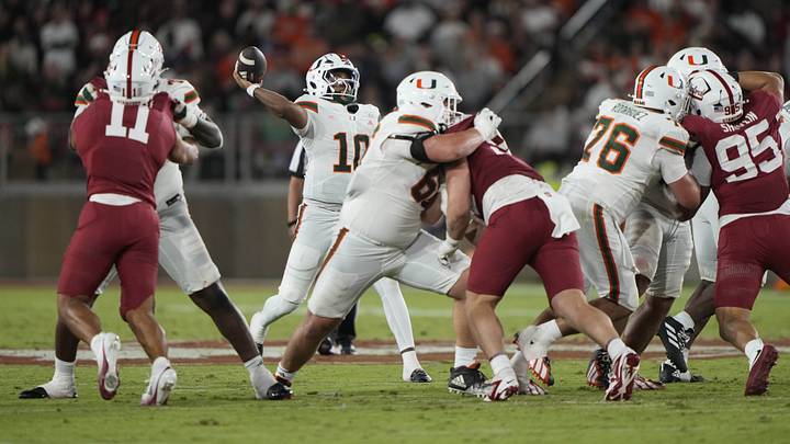 Sep 4, 2026; Stanford, California, USA;  Miami Hurricanes quarterback Darian Mensah (10) throws downfield against the Stanford Cardinal during the third quarter at Stanford Stadium.  Mandatory Credit: Stan Szeto-Imagn Images