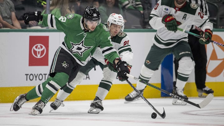 Sep 26, 2023; Dallas, Texas, USA; Dallas Stars center Mavrik Bourque (22) and Minnesota Wild center