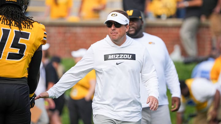 Sep 14, 2024; Columbia, Missouri, USA; Missouri Tigers head coach Eli Drinkwitz greets players against the Boston College Eagles prior to a game at Faurot Field at Memorial Stadium. Mandatory Credit: Denny Medley-Imagn Images Sep 14, 2024; Columbia, Missouri, USA; Missouri Tigers head coach Eli Drinkwitz greets players against the Boston College Eagles prior to a game at Faurot Field at Memorial Stadium. Mandatory Credit: Denny Medley-Imagn Images