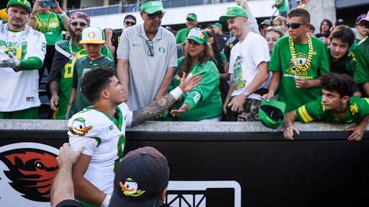 Oregon Ducks quarterback Dillon Gabriel (8) greets family after winning the annual rivalry game against the Oregon State Beavers on Saturday, Sept. 14, 2024 at Reser Stadium in Corvallis, Ore.