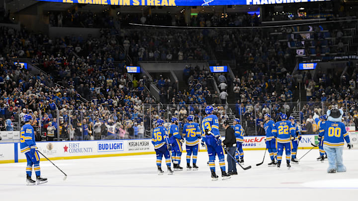Apr 5, 2025; St. Louis, Missouri, USA;  St. Louis Blues salute their fans and celebrate after the Blues won their franchise record 12th straight win after a victory over the Colorado Avalanche at Enterprise Center. Mandatory Credit: Jeff Curry-Imagn Images