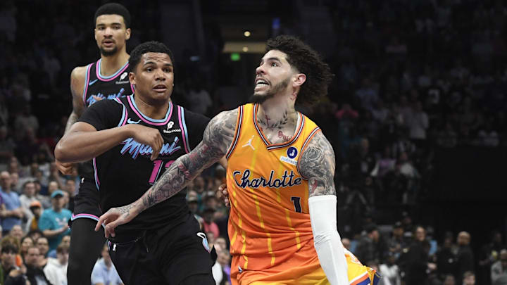 Mar 6, 2026; Charlotte, North Carolina, USA;  Charlotte Hornets guard LaMelo Ball (1) drives past Miami Heat guard Dru Smith (12) during the second half at the Spectrum Center. Mandatory Credit: Sam Sharpe-Imagn Images