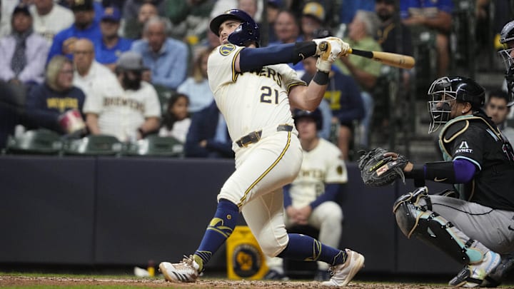 Aug 25, 2025; Milwaukee, Wisconsin, USA; Milwaukee Brewers third base Caleb Durbin (21) hits a home run against the Arizona Diamondbacks in the eighth inning at American Family Field. Mandatory Credit: Michael McLoone-Imagn Images