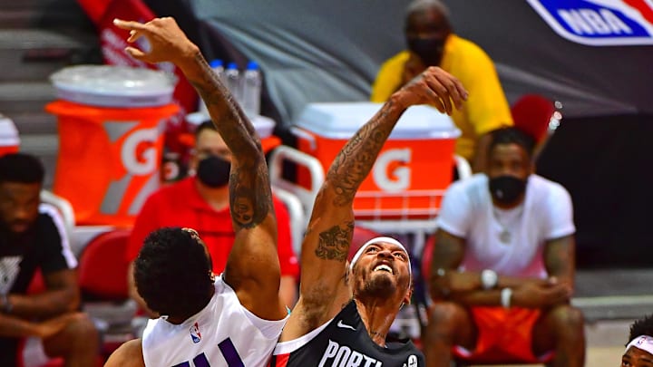 Aug 8, 2021; Las Vegas, Nevada, USA; Portland Trail Blazers forward Michael Beasley (50) battles Charlotte Hornets center Nick Richards (14) for a jump ball during an NBA Summer League game at Cox Pavilion. Mandatory Credit: Stephen R. Sylvanie-Imagn Images Aug 8, 2021; Las Vegas, Nevada, USA; Portland Trail Blazers forward Michael Beasley (50) battles Charlotte Hornets center Nick Richards (14) for a jump ball during an NBA Summer League game at Cox Pavilion. Mandatory Credit: Stephen R. Sylvanie-Imagn Images
