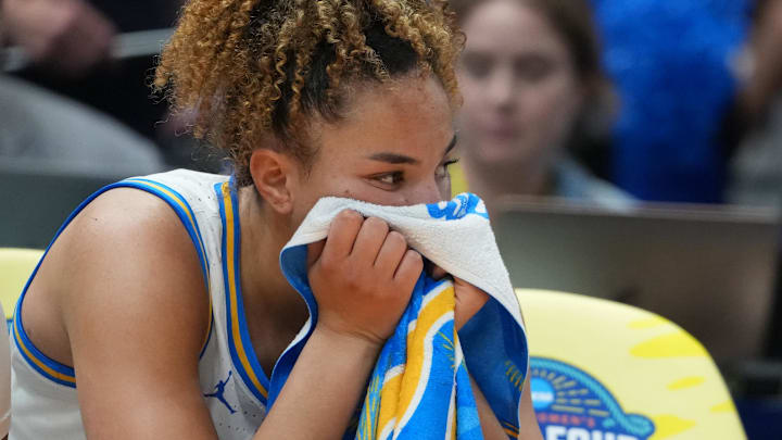 Apr 4, 2025; Tampa, FL, USA; UCLA Bruins guard Kiki Rice (1) reacts on the bench during the fourth quarter in a semifinal of the women's 2025 NCAA tournament against the Connecticut Huskies at Amalie Arena. Mandatory Credit: Kirby Lee-Imagn Images Apr 4, 2025; Tampa, FL, USA; UCLA Bruins guard Kiki Rice (1) reacts on the bench during the fourth quarter in a semifinal of the women's 2025 NCAA tournament against the Connecticut Huskies at Amalie Arena. Mandatory Credit: Kirby Lee-Imagn Images