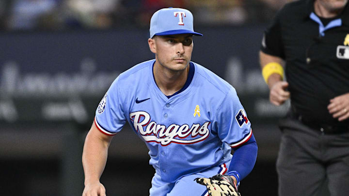 Sep 1, 2024; Arlington, Texas, USA; Texas Rangers first baseman Justin Foscue (56) looks for the ball during the fourth inning against the Oakland Athletics at Globe Life Field. Mandatory Credit: Jerome Miron-Imagn Images