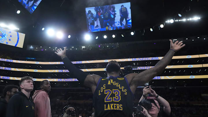 Nov 18, 2025; Los Angeles, California, USA; Los Angeles Lakers forward LeBron James (23) throws powdered chalk into the air during the game against the Utah Jazz at Crypto.com Arena. Mandatory Credit: Kirby Lee-Imagn Images