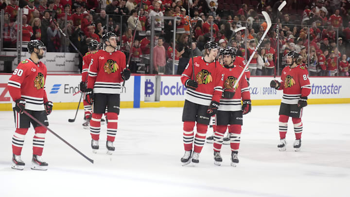 Mar 23, 2025; Chicago, Illinois, USA; The Chicago Blackhawks celebrate their win against the Philadelphia Flyers at United Center. Mandatory Credit: David Banks-Imagn Images