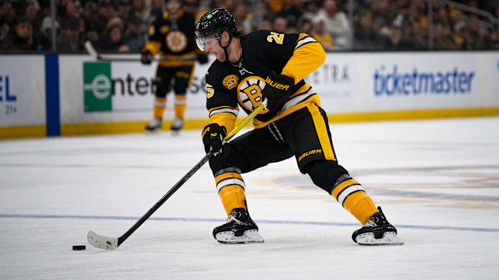 Dec 1, 2024; Boston, Massachusetts, USA; Boston Bruins defenseman Brandon Carlo (25) skates with the puck during the second period of a game against the Montreal Canadiens at TD Garden. Mandatory Credit: Natalie Reid-Imagn Images