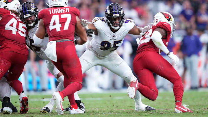 Oct 29, 2023; Glendale, Arizona, USA; Baltimore Ravens linebacker Tavius Robinson (95) blocks against the Arizona Cardinals during the second half at State Farm Stadium. Mandatory Credit: Joe Camporeale-Imagn Images Oct 29, 2023; Glendale, Arizona, USA; Baltimore Ravens linebacker Tavius Robinson (95) blocks against the Arizona Cardinals during the second half at State Farm Stadium. Mandatory Credit: Joe Camporeale-Imagn Images