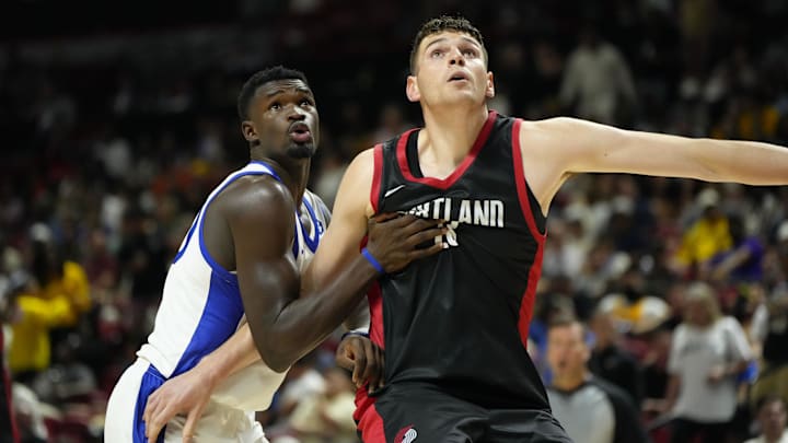 Jul 15, 2024; Las Vegas, NV, USA; Portland Trail Blazers center Donovan Clingan (23) competes against Philadelphia 76ers forward/center Adem Bona (30) during the second half at Thomas & Mack Center. Mandatory Credit: Lucas Peltier-Imagn Images Jul 15, 2024; Las Vegas, NV, USA; Portland Trail Blazers center Donovan Clingan (23) competes against Philadelphia 76ers forward/center Adem Bona (30) during the second half at Thomas & Mack Center. Mandatory Credit: Lucas Peltier-Imagn Images