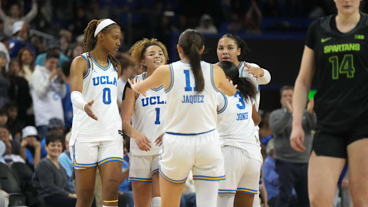 Feb 16, 2025; Los Angeles, California, USA; UCLA Bruins forward Janiah Barker (0) and guard Kiki Rice (1) and guard Gabriela Jaquez (11) and guard Londynn Jones (3) and forward Timea Gardiner (30) celebrate at the end of the game against the Michigan State Spartans at Pauley Pavilion presented by Wescom. Mandatory Credit: Kirby Lee-Imagn Images