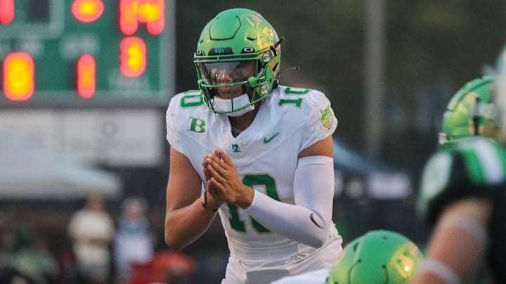 Nebraska quarterback commit Dayton Raiola taking a snap in high school. Nebraska quarterback commit Dayton Raiola taking a snap in high school.