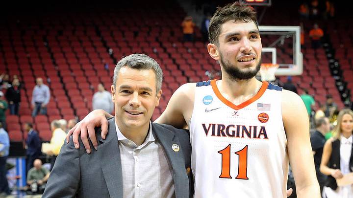 Virginia Cavaliers head coach Tony Bennett (L) and guard Ty Jerome (R) exit the court together. Virginia Cavaliers head coach Tony Bennett (L) and guard Ty Jerome (R) exit the court together.
