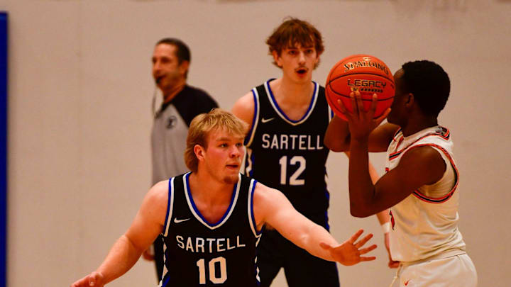 Sartell boys basketball senior Brayden Simones plays defense during a 2024 Granite City Classic game Dec. 27 at home versus Osseo. The Sabres won 60-55.