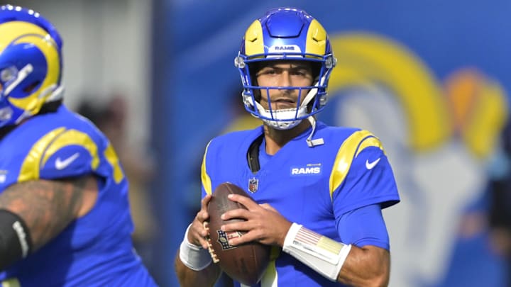Jan 5, 2025; Inglewood, California, USA; Los Angeles Rams quarterback Jimmy Garoppolo (11) sets to pass in the first half against the Seattle Seahawks at SoFi Stadium. Mandatory Credit: Jayne Kamin-Oncea-Imagn Images