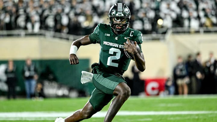 Michigan State's Aidan Chiles runs for a gain against Iowa in the second quarter on Saturday, Oct. 19, 2024, at Spartan Stadium in East Lansing.