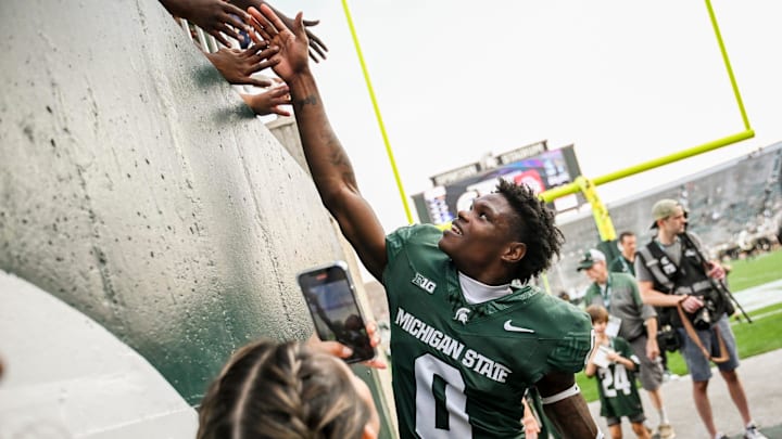 Michigan State's Charles Brantley celebrates with fans after the win over Prairie View A&M on Saturday, Sept. 14, 2024, at Spartan Stadium in East Lansing.