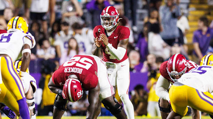 Nov 9, 2024; Baton Rouge, Louisiana, USA; Alabama Crimson Tide quarterback Jalen Milroe (4) calls for the ball against LSU Tigers safety Major Burns (8) during the second half at Tiger Stadium. Nov 9, 2024; Baton Rouge, Louisiana, USA; Alabama Crimson Tide quarterback Jalen Milroe (4) calls for the ball against LSU Tigers safety Major Burns (8) during the second half at Tiger Stadium.