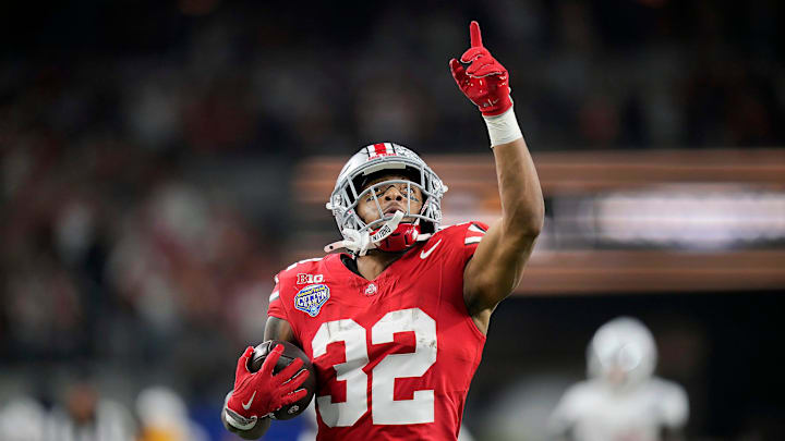Ohio State Buckeyes running back TreVeyon Henderson (32) scores a touchdown on a 75-yard touchdown catch and run against Texas Longhorns in the second quarter of the Cotton Bowl Classic during the College Football Playoff semifinal game at AT&T Stadium in Arlington, Texas on January, 10, 2025.