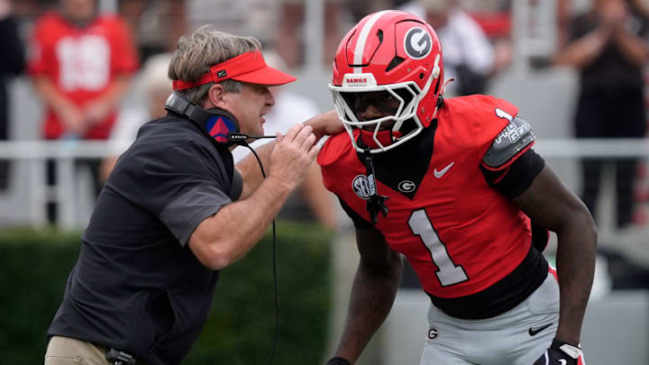 Georgia coach Kirby Smart speaks with Georgia wide receiver Zachariah Branch (1) during the first half of a NCAA college football game against Kentucky in Athens, Ga., on Saturday, October 4, 2025.