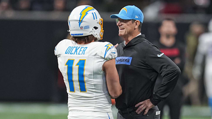 Dec 1, 2024; Atlanta, Georgia, USA; Los Angeles Chargers head coach Jim Harbaugh talks to place kicker Cameron Dicker (11) before the game against the Atlanta Falcons at Mercedes-Benz Stadium. Mandatory Credit: Dale Zanine-Imagn Images