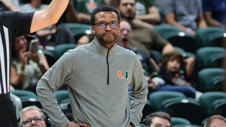 Nov 23, 2025; Coral Gables, Florida, USA; Miami Hurricanes head coach Jai Lucas watches from the sideline against the Delaware State Hornets during the second half at Watsco Center. Mandatory Credit: Sam Navarro-Imagn Images