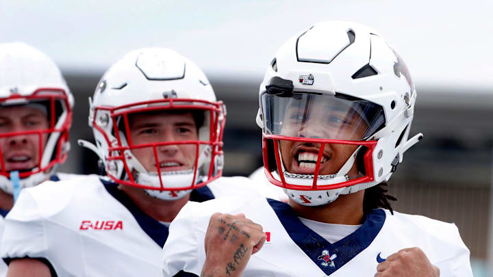 Liberty quarterback Kaidon Salter (7) celebrates his touchdown against Middle Tennessee during the Salute to Veterans & Armed Forces game at MTSU on Saturday, Nov. 9, 2024.
