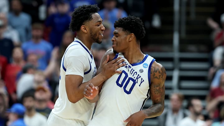 Mouhamed Dioubate and Otega Oweh of the Kentucky Wildcats celebrate in overtime.