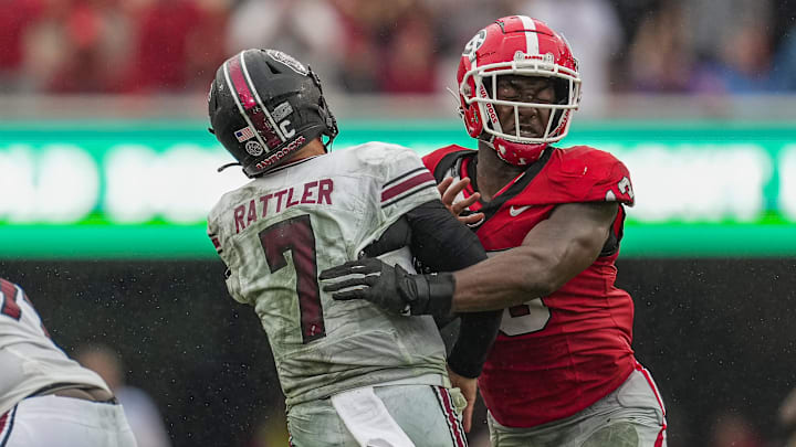 Sep 16, 2023; Athens, Georgia, USA; South Carolina Gamecocks quarterback Spencer Rattler (7) is hit by Georgia Bulldogs defensive lineman Mykel Williams (13) after throwing the ball during the second half at Sanford Stadium. Mandatory Credit: Dale Zanine-Imagn Images Sep 16, 2023; Athens, Georgia, USA; South Carolina Gamecocks quarterback Spencer Rattler (7) is hit by Georgia Bulldogs defensive lineman Mykel Williams (13) after throwing the ball during the second half at Sanford Stadium. Mandatory Credit: Dale Zanine-Imagn Images