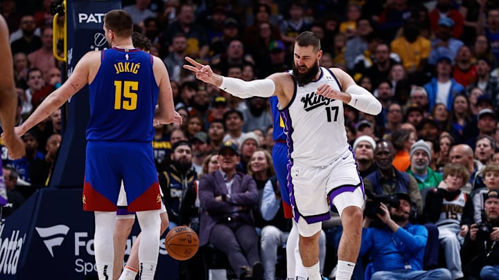 Mar 5, 2025; Denver, Colorado, USA; Sacramento Kings center Jonas Valanciunas (17) reacts after a play as Denver Nuggets center Nikola Jokic (15) looks on in the second quarter at Ball Arena. Mandatory Credit: Isaiah J. Downing-Imagn Images
