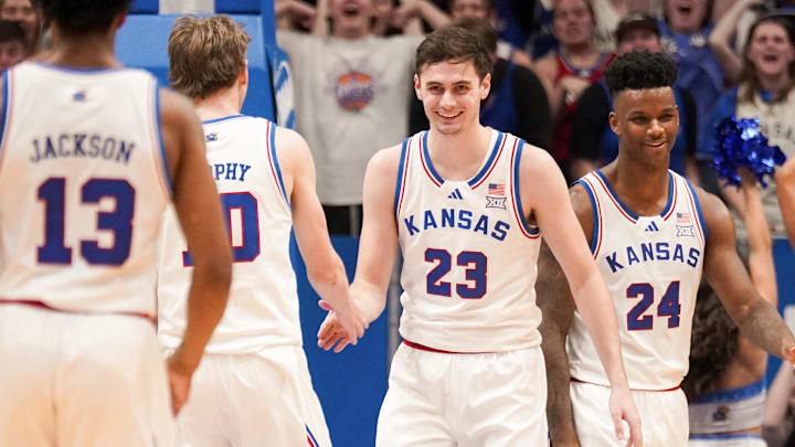 Feb 24, 2024; Lawrence, Kansas, USA; Kansas Jayhawks forward Parker Braun (23) celebrates with teammates