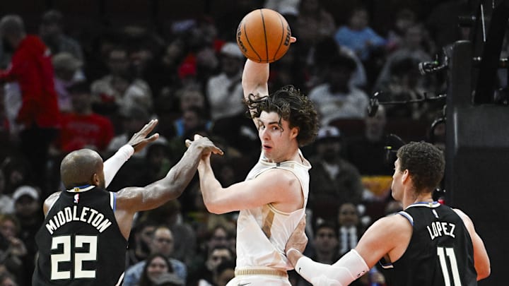 Dec 28, 2024; Chicago, Illinois, USA;  Chicago Bulls guard Josh Giddey (3) passes the ball away from Milwaukee Bucks forward Khris Middleton (22) and  center Brook Lopez (11) during the second half at the United Center. Mandatory Credit: Matt Marton-Imagn Images