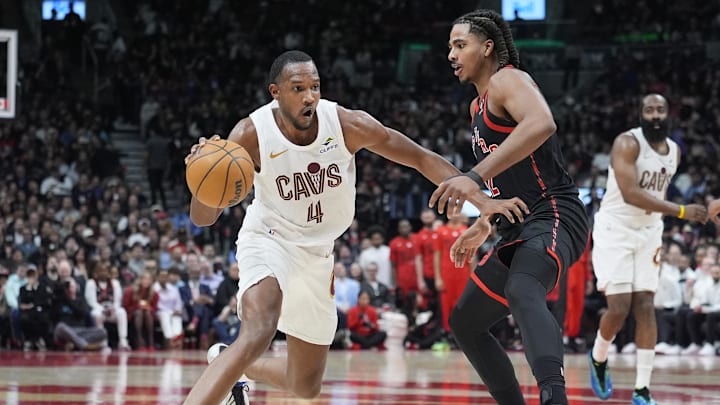 Apr 23, 2026; Toronto, Ontario, CAN; Cleveland Cavaliers forward Evan Mobley (4) drives to the basket against Toronto Raptors forward Collin Murray-Boyles (12) during the second half of game three of the first round of the 2026 NBA Playoffs at Scotiabank Arena. Mandatory Credit: John E. Sokolowski-Imagn Images
