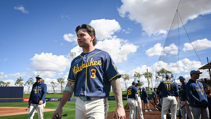 Milwaukee Brewers infield prospect Andrew Fischer walks across the field during spring training workouts Tuesday, February 17, 2026, at American Family Fields of Phoenix in Phoenix, Arizona.
