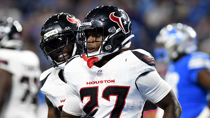 Aug 23, 2025; Detroit, Michigan, USA; Houston Texans running back Woody Marks (27) celebrates with teammates after scoring a touchdown against the Detroit Lions in the second quarter at Ford Field. Mandatory Credit: Eamon Horwedel-Imagn Images
