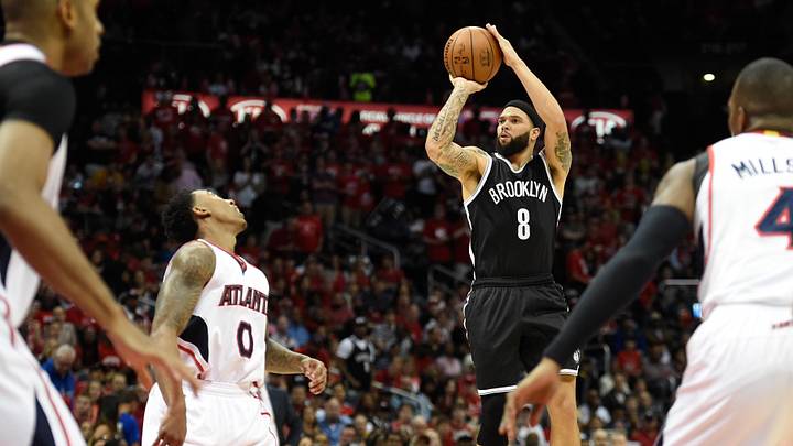 Apr 19, 2015; Atlanta, GA, USA; Brooklyn Nets guard Deron Williams (8) shoots over Atlanta Hawks guard Jeff Teague (0) during the first half in game one of the first round of the NBA Playoffs at Philips Arena. Mandatory Credit: Dale Zanine-Imagn Images