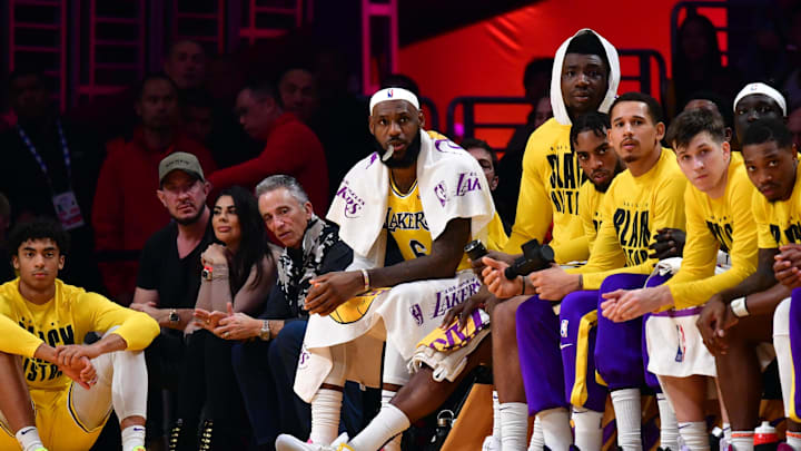 Feb 7, 2023; Los Angeles, California, USA; Los Angeles Lakers forward LeBron James (6) watches from the bench in the second quarter against the Oklahoma City Thunder at Crypto.com Arena. Mandatory Credit: Gary A. Vasquez-Imagn Images