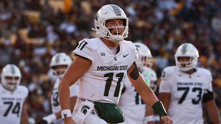 Nov 1, 2025; Minneapolis, Minnesota, USA; Michigan State Spartans quarterback Alessio Milivojevic (11) celebrates a touchdown against the Minnesota Golden Gophers during the second half at Huntington Bank Stadium. Mandatory Credit: Matt Krohn-Imagn Images
