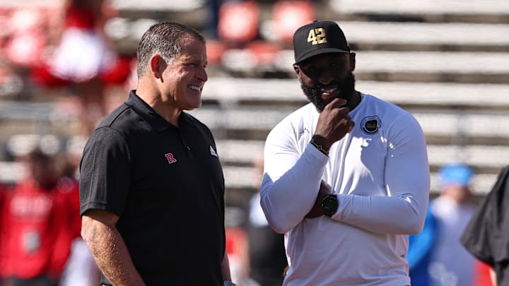Oct 19, 2024; Piscataway, New Jersey, USA; Rutgers Scarlet Knights head coach Greg Schiano, left, talks with UCLA Bruins head coach DeShaun Foster before their Big Ten conference game at SHI Stadium. Mandatory Credit: Vincent Carchietta-Imagn Images Oct 19, 2024; Piscataway, New Jersey, USA; Rutgers Scarlet Knights head coach Greg Schiano, left, talks with UCLA Bruins head coach DeShaun Foster before their Big Ten conference game at SHI Stadium. Mandatory Credit: Vincent Carchietta-Imagn Images
