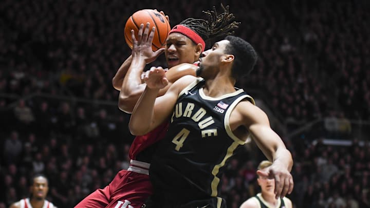 Jan 31, 2025; West Lafayette, Indiana, USA; Indiana Hoosiers forward Malik Reneau (5) is fouled by Purdue Boilermakers forward Trey Kaufman-Renn (4) during the first half at Mackey Arena. Mandatory Credit: Robert Goddin-Imagn Images