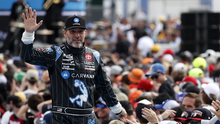 Feb 16, 2025; Daytona Beach, Florida, USA; NASCAR Cup Series driver Jimmie Johnson (84) walks onto the driver introduction stage to greet fans before the Daytona 500 at Daytona International Speedway. Mandatory Credit: Peter Casey-Imagn Images Feb 16, 2025; Daytona Beach, Florida, USA; NASCAR Cup Series driver Jimmie Johnson (84) walks onto the driver introduction stage to greet fans before the Daytona 500 at Daytona International Speedway. Mandatory Credit: Peter Casey-Imagn Images