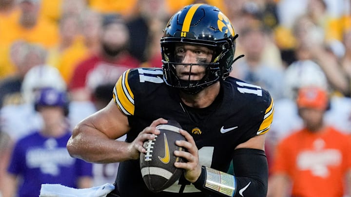 Iowa Hawkeyes quarterback Mark Gronowski (11) looks to pass the ball during a football game against the Massachusetts Minutemen Sept. 13, 2025 at Kinnick Stadium in Iowa City, Iowa.